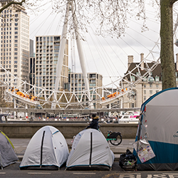 Many tents of homeless people at the side of the road of the Victoria Embankment. 