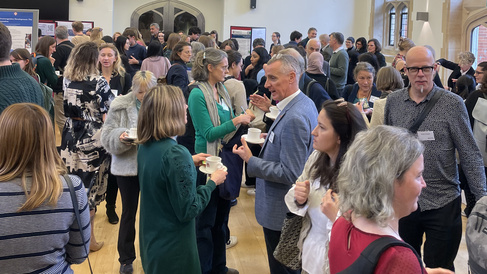 Many people talking at the Cambridge Public Health showcase