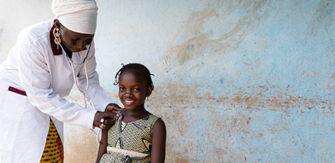 Pediatrician examines a girl during routine respiratory check-up