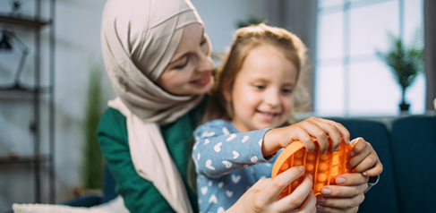 Mother and child play with sensory fidget toy