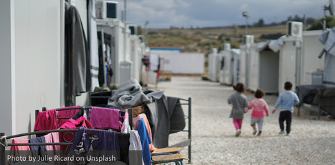 Syrian refugees walking on street during daytime