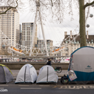 Many tents of homeless people at the side of the road of the Victoria Embankment. 
