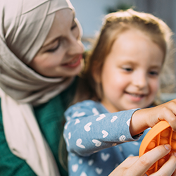 Mother and child play with sensory fidget toy