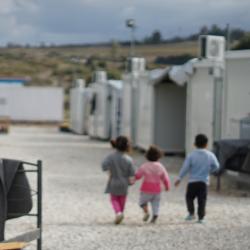 Syrian refugees walking on street during daytime