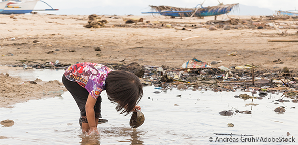 Young girl searches wasteland