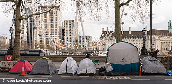 Many tents of homeless people at the side of the road of the Victoria Embankment. 