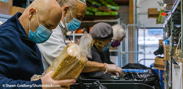 Volunteers prepare food for families in need of help during covid-19 pandemic